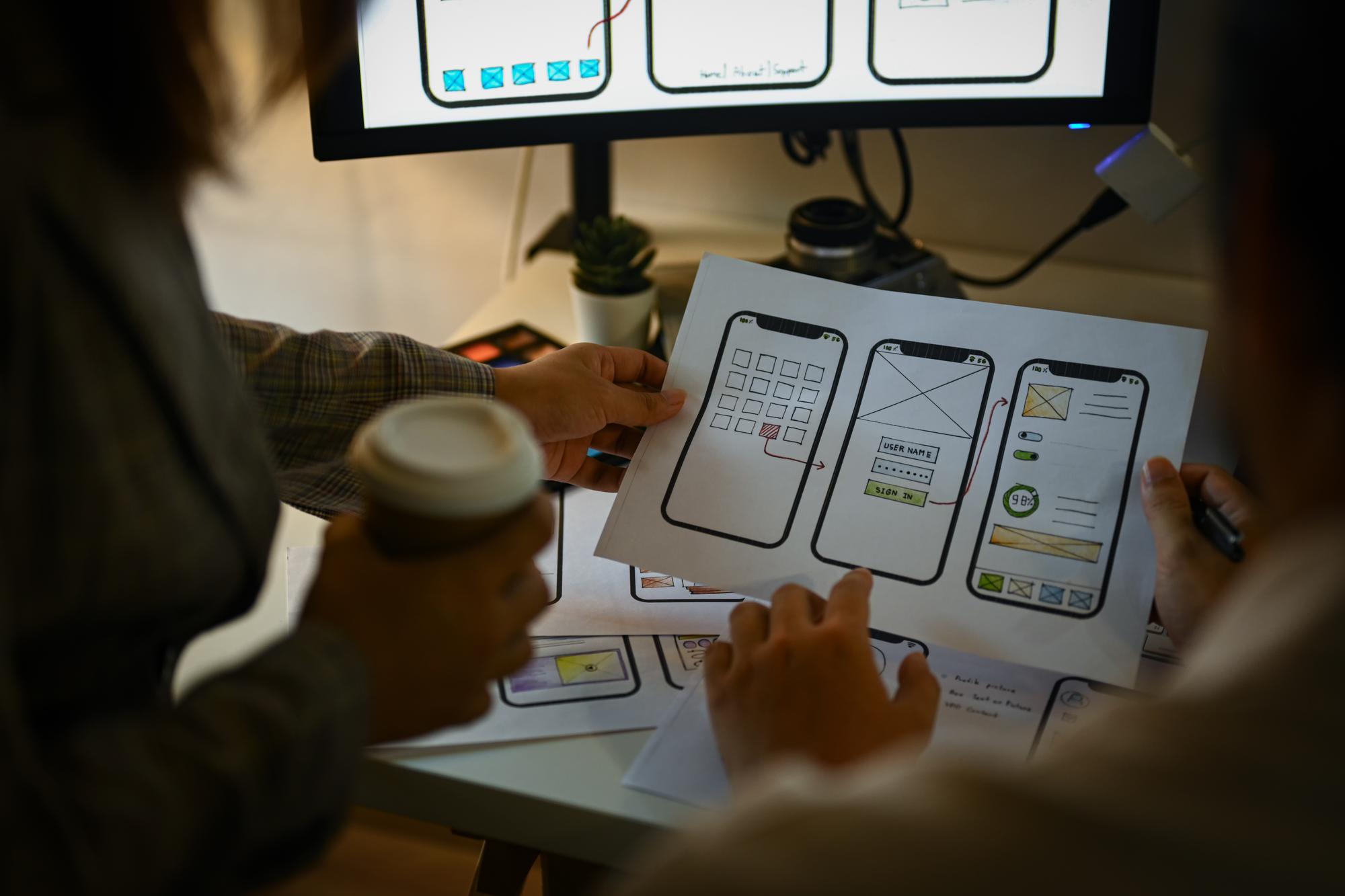creative-designer-team-working-with-template-layout-framework-mobile-phone-application_35674-24184