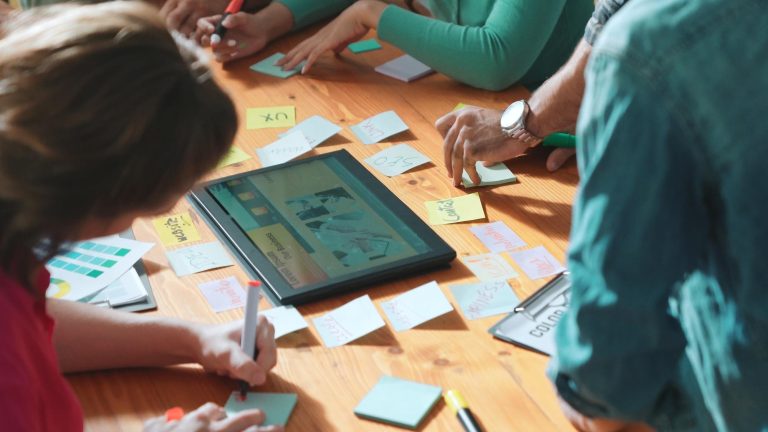 top-view-manager-writing-idea-sticky-notes-explain-idea-symposium_31965-377460